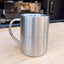 Adult 304 stainless steel double wall camping mug sitting on a camper van pantry