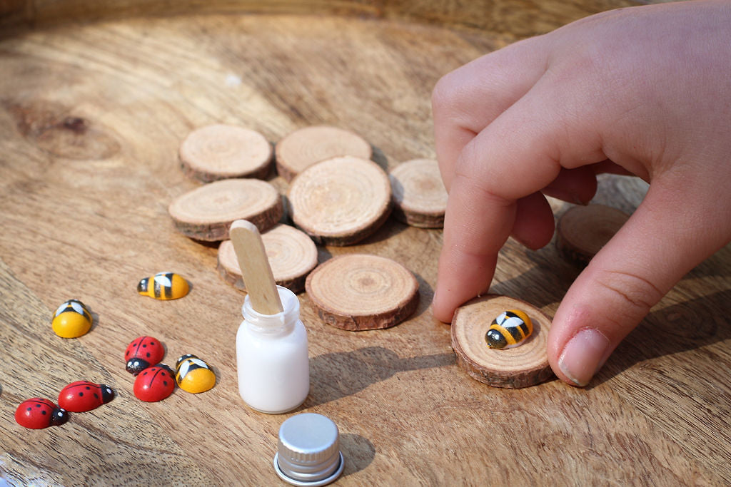 Child's hands in shot making the poppy and daisy tic tac toe kit