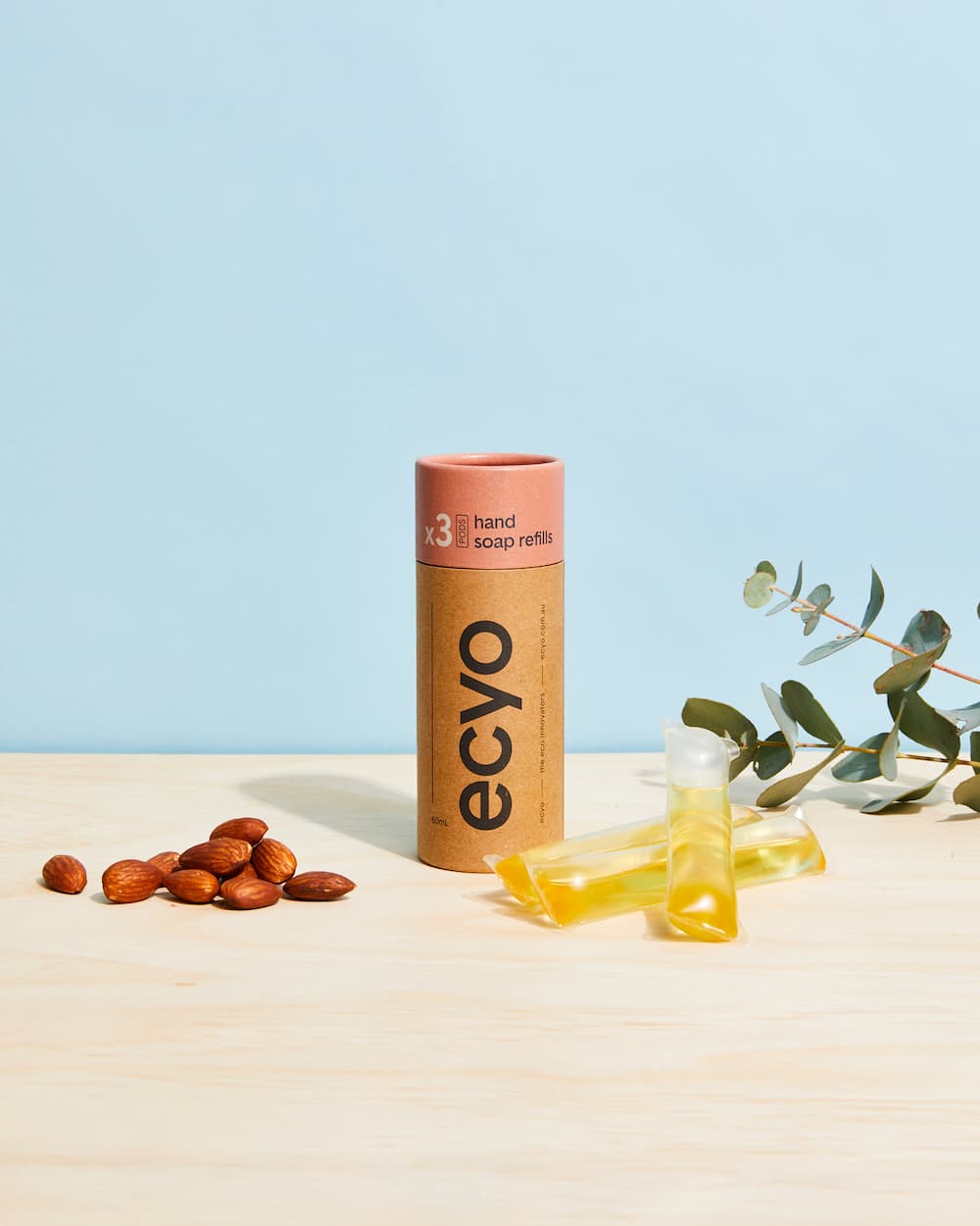 ecyo hand soap refills cylinder packaging with three refills and almonds and greenery