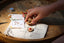 Child's hands in shot making the poppy and daisy tic tac toe kit