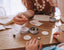 Kids making poppy and daisy pastel bag tags