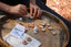 Child's hands in shot making the poppy and daisy tic tac toe kit 