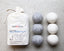 That Red House Australian wool dryer balls with cotton storage bag on a gray surface